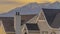 Panorama Roofs of houses with a striking mountain capped with snow in the background