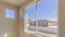 Panorama Room of a new house with a large window overlooking homes mountain and sky