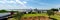 Panorama row of canons display at historic Vicksburg battlefield overlooking twin old new bridges across Mississippi River,