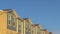 Panorama Row of townhouses at a neighborhood with view of mountain and blue sky