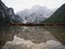 Panorama rowing boat reflection of Lago di Braies Pragser Wildsee alpine mountain lake Dolomites alps South Tyrol Italy