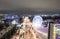 Panorama of the Russian city of Kirov from a height on a winter night. Oktyabrsky Avenue and Ferris Wheel in the New