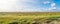 Panorama of salt marshes with sand couch and marram grass and se