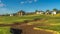 Panorama Sand bunker and fairway of a golf course with residential area in the background