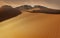 Panorama of sand dunes Sahara Desert at sunset. Endless dunes of yellow sand. Desert landscape Waves sand nature