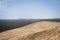 Panorama of the sandy Pila dune Dune du Pyla with the pine forest of Landes de Gascogne in Background.