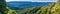 Panorama in Santa Cruz mountains with evergreen forests covering hills and valleys as seen from Castle Rock State Park, San