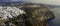 Panorama of Santorini island, Cyclades, Aegean sea, Greece. Skyline of capital city Fira on caldera of volcano mountain