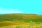 Panorama from Sassotetto with green, yellow and brown grass