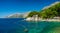Panorama of the sea coast of Croatia. Brela. Makarska Riviera.  Beach and Adriatic Sea. Summer season for vacation and recreation.