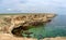 Panorama of sea coast with steep textured limestone rocks