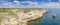 Panorama of sea coast with steep textured limestone rocks