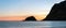 Panorama shot from Haukland beach in Lofoten, Norway during sunset and moon in the background.