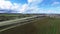 Panorama shot of a highway with car traffic and beautiful plantation