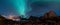 Panorama shot with Northern Lights Aurora Borealis with classic view of the fisherman s village of Hamnoy, near Reine in