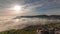 Panorama showing aerial View of Sesimbra Town and Port covered by fog timelapse, Portugal.