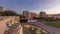 Panorama showing lawn at Alameda Dom Afonso Henriques and the Luminous Fountain aerial day to night timelapse in Lisbon.