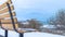 Panorama Side view of a bench overlooking frozen Utah Lake and overcast sky in winter