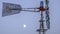 Panorama Side view of a windpump with moon and sky in the background