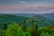 Panorama of the Silesian Beskids from Rownica peak at sunrise. Poland