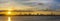 Panorama of silhouette of skyline of Shenzhen city, China at sunset. Viewed from Hong Kong border