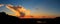 Panorama silhouette sunset with mountain and sky.