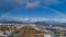 Panorama of siska district in Ljubljana, Slovenia accompanied by beautiful rainbow spanning over the horison over the Smarna Gora