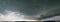 Panorama of the sky during a thunderstorm. Dark dramatic stormy sky