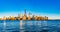 Panorama of skyline of downtown Manhattan over Hudson River under blue sky, in New York City, USA