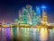 Panorama of Skyscrapers of Moscow City with reflections in Moscow river at night.