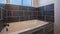 Panorama Small fitted tiled bathtub in a modern bathroom