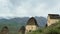 Panorama of small stone mausoleums standing on the side of the mountain