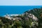 panorama of small town Arenzano in Liguria with its harbor and famous church `GesÃ¹ Bambino di Praga` in the background