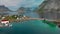 Panorama of small town separated by fjords against mountains