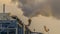 Panorama Smokestack of a Power Plant in Utah Valley releasing steam into the air