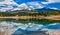 Panorama Snow-capped and forested mountains near a mountain lake, Pikes Peak Mountains in Colorado Spring, Colorado, US