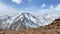Panorama of snow-capped mountains. Beautiful mountain landscape. Natural calm background