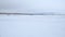 Panorama of the snow field on a cloudy winter day