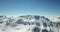 Panorama of snow mountains. The tops of the peaks. Epic moments drone.