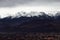 Panorama of snowing mountains of Alps and clouds at evening