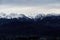 Panorama of snowing mountains of Alps at evening