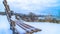 Panorama Snowy hilly terrain by the frosted Utah Lake in winter with empty outdoor bench