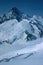 Panorama of snowy mountains and high alpine peaks in wintery Bernese Oberland in Switzerland