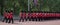 Panorama of soldiers in traditional uniform march down The Mall in London during Trooping of the Colour parade