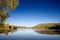 Panorama of Sotsko Jezero, or lake Sot, in Fruska Gora, in Serbia, Europe, in summer, at dusk, into the light.