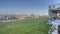 Panorama Spacious yard of home with view of lake and snowy mountain under blue sky