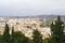 Panorama of the Spanish city of Malaga. Buildings  against a cloudy sky. Dramatic sky over the city.