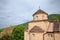 Panorama of the Srediste Monastery at dusk. Manastir Srediste a Serbian orthodox monastery of the Vrsacki Breg  mountain and park