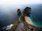 Panorama of stairs at Kelingking Beach blue turquoise tropical ocean limestone cliff Nusa Penida Island Bali Indonesia