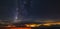 Panorama of the starry sky over the red horizon